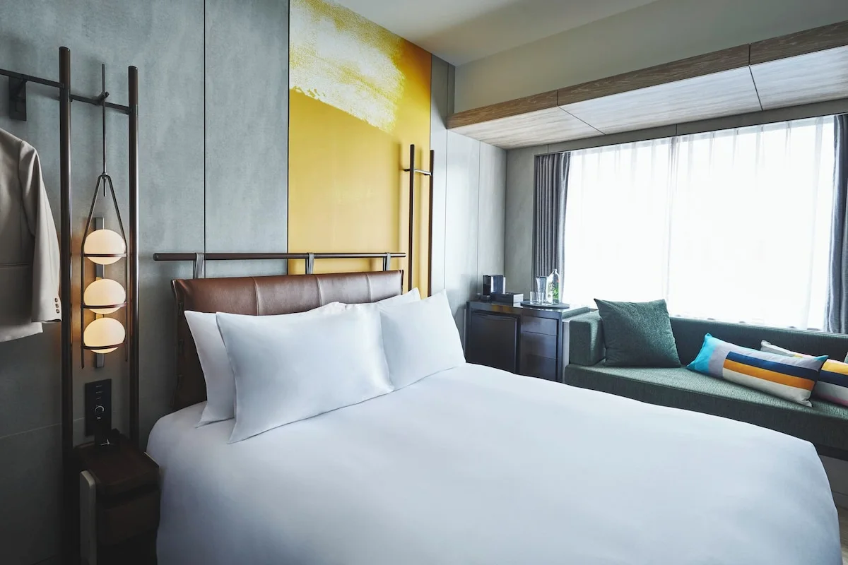 voco Osaka Central premium room with king bed and window sofa