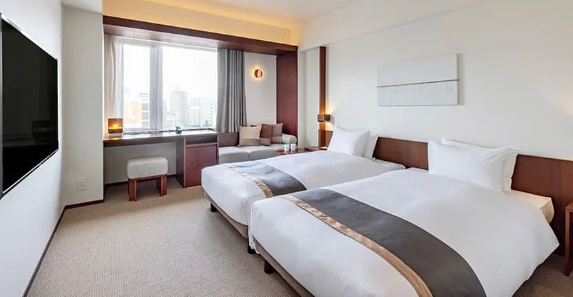 Residential Twin avec kitchenette et lave-linge séchant au Tokyu STAY Fukuoka Tenjin