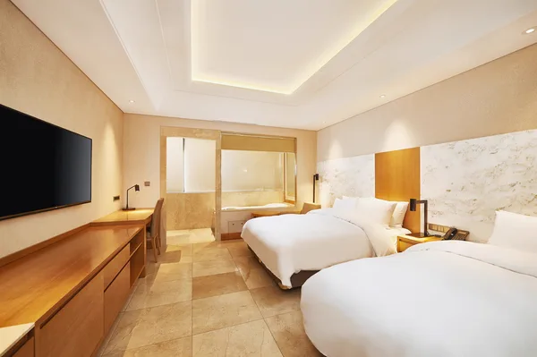Chambre à deux lits avec séparation de salle de bain à l’Arban Hotel Busan