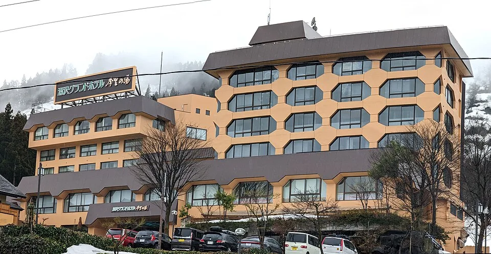 actual hotel wide exterior in snow, 2023